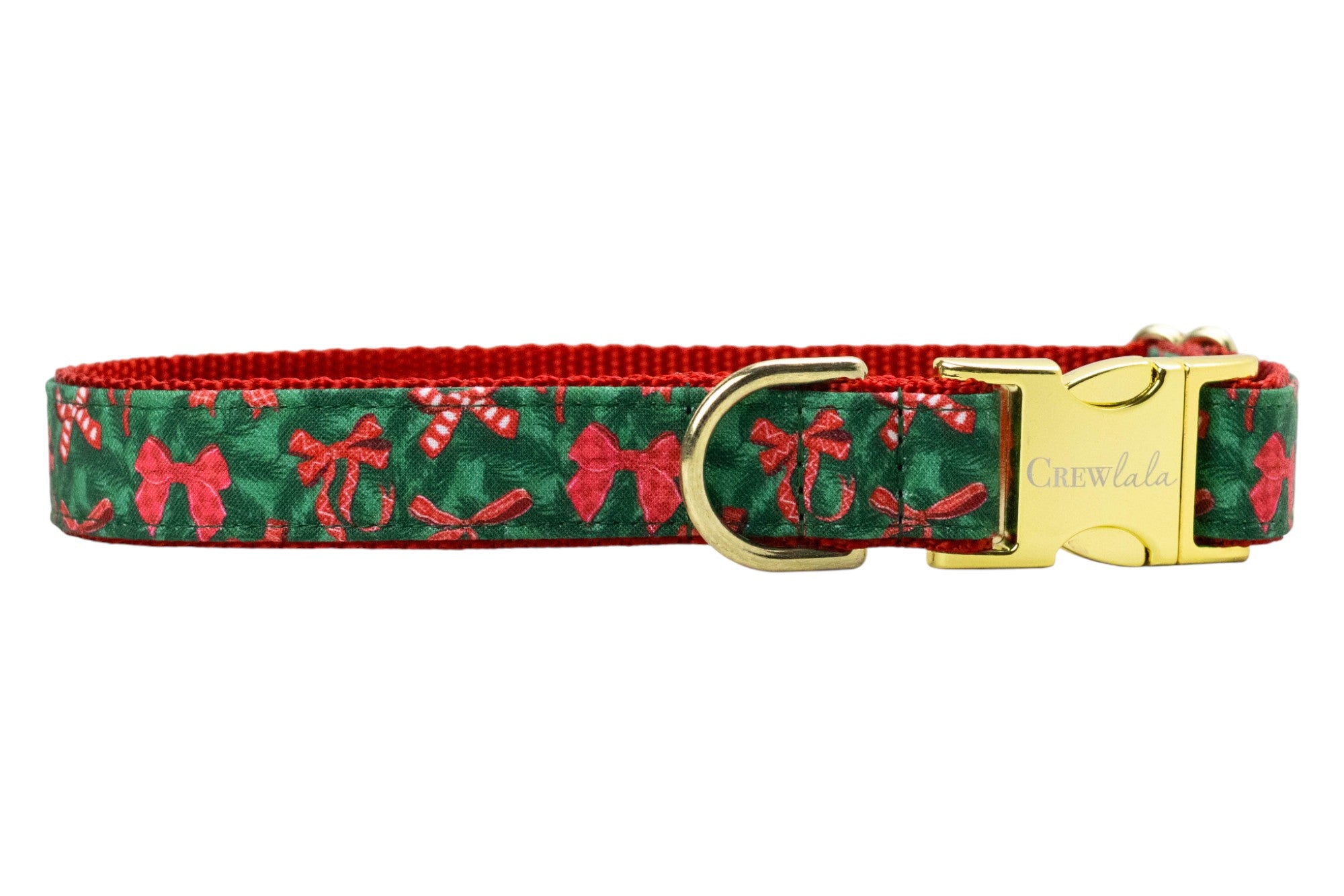 Festive dog collar featuring a pine green background patterned with bows and candy canes, stitched onto a nylon base. It includes polished hardware: a sleek side-release buckle engraved with “Crewlala,” a sturdy D-ring.