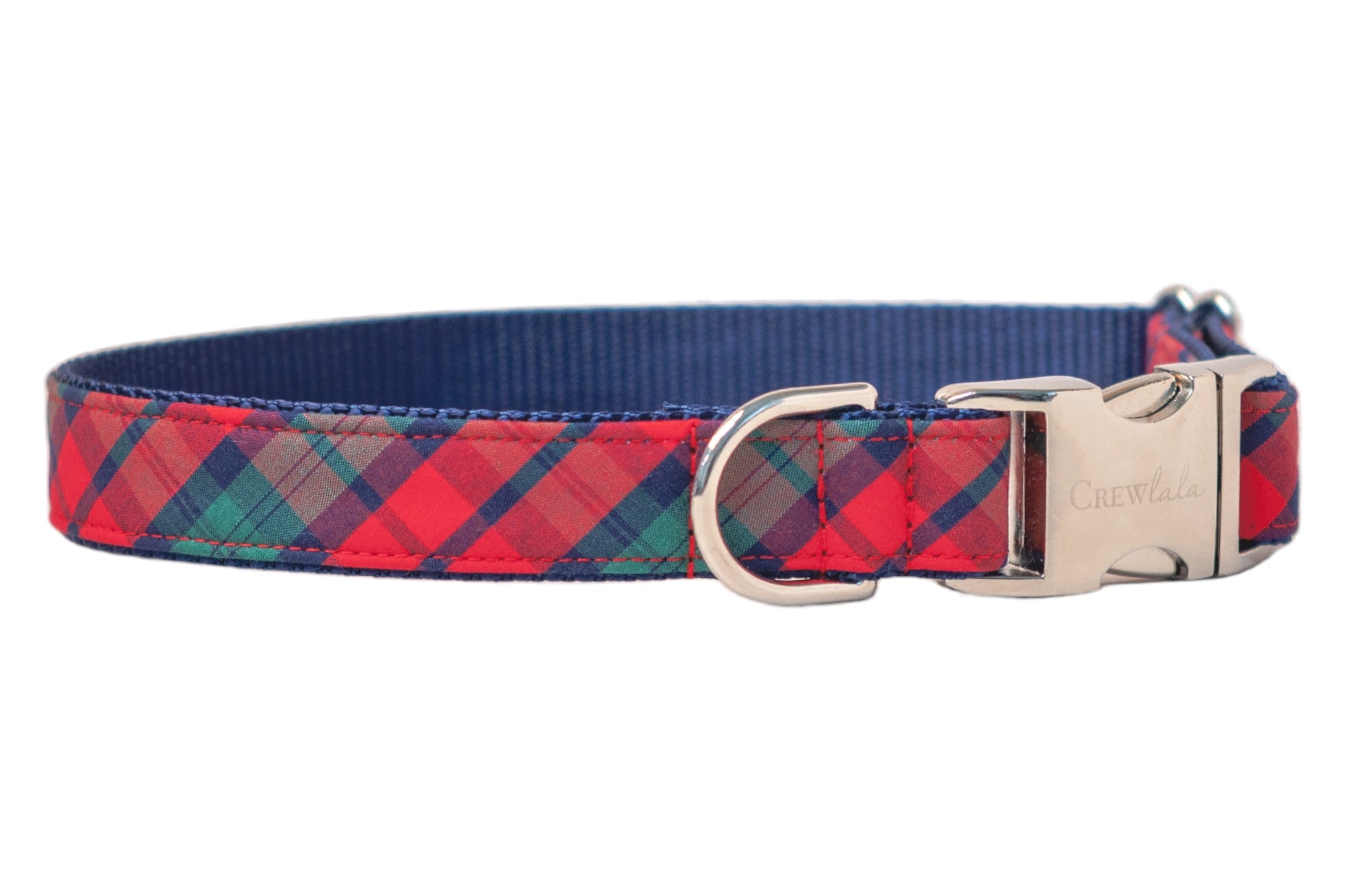Plaid dog collar with festive and colorful diagonal checks, backed by a nylon webbing interior. It features a sleek metal D-ring and a durable buckle clasp engraved with the brand “Crewlala.” Neatly stitched and designed for everyday wear or the winter holidays.