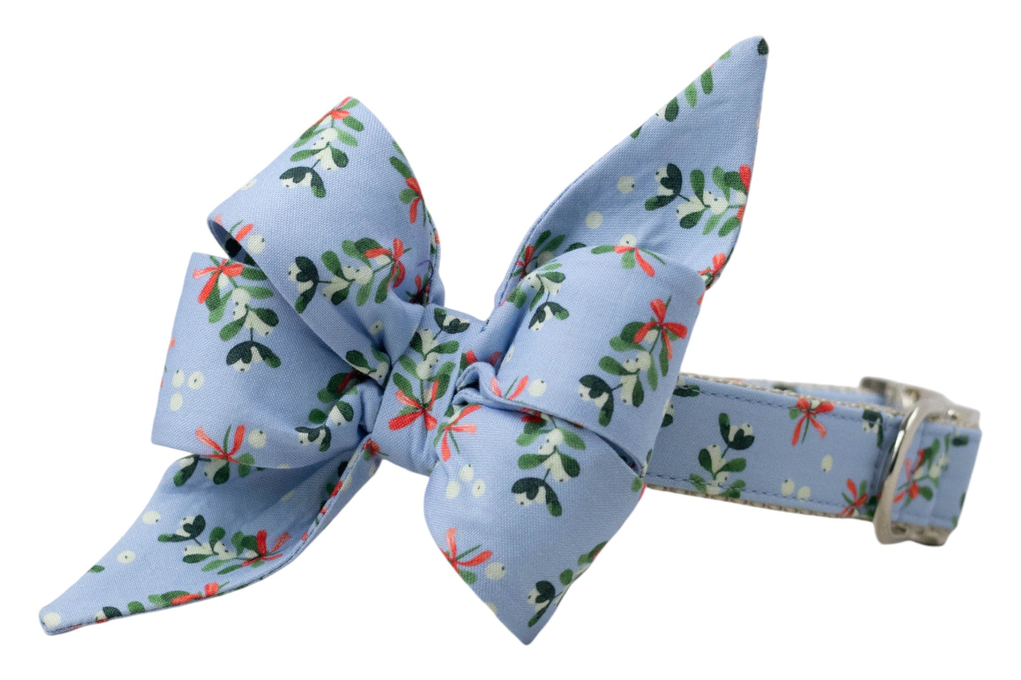 A light blue dog collar with an attached matching belle bow, featuring a festive mistletoe print of leaves, berries, and ribbon bows. The collar includes shiny hardware, combining seasonal charm with elegance.