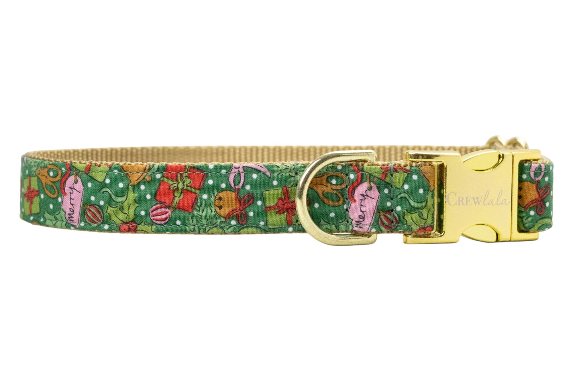Festive Christmas dog collar in green with an all-over holiday print of gifts, holly, candy canes, bells, and ribbons, accented by snowy dots. Designed with a nylon woven backing, polished hardware, and engraved buckle.