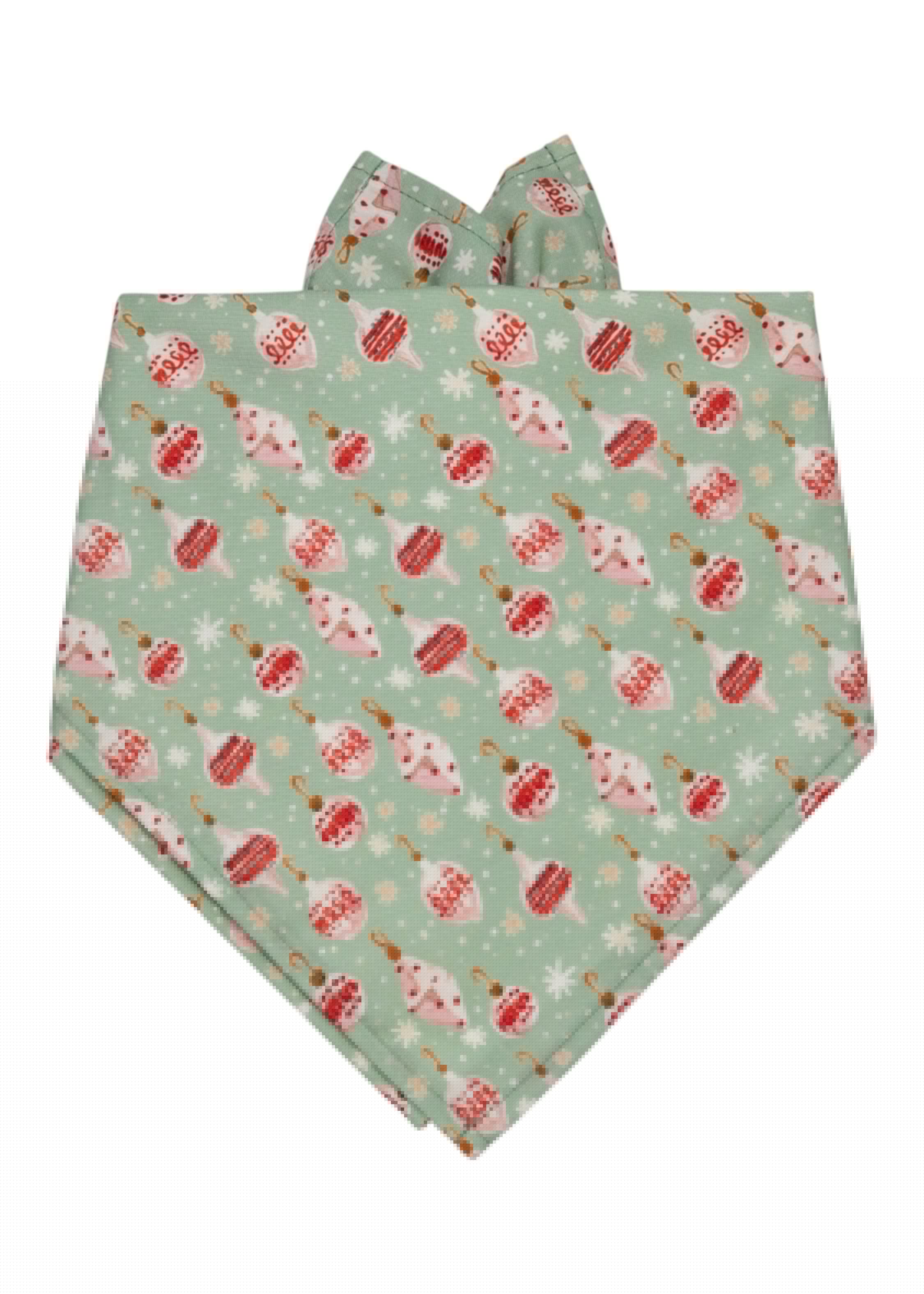 A holiday-themed dog bandana made from light green fabric with vintage-style Christmas ornaments, hooks, and scattered snowflakes. Designed to tie around a dog's neck, with clean stitching and a soft drape for a festive, comfortable fit.