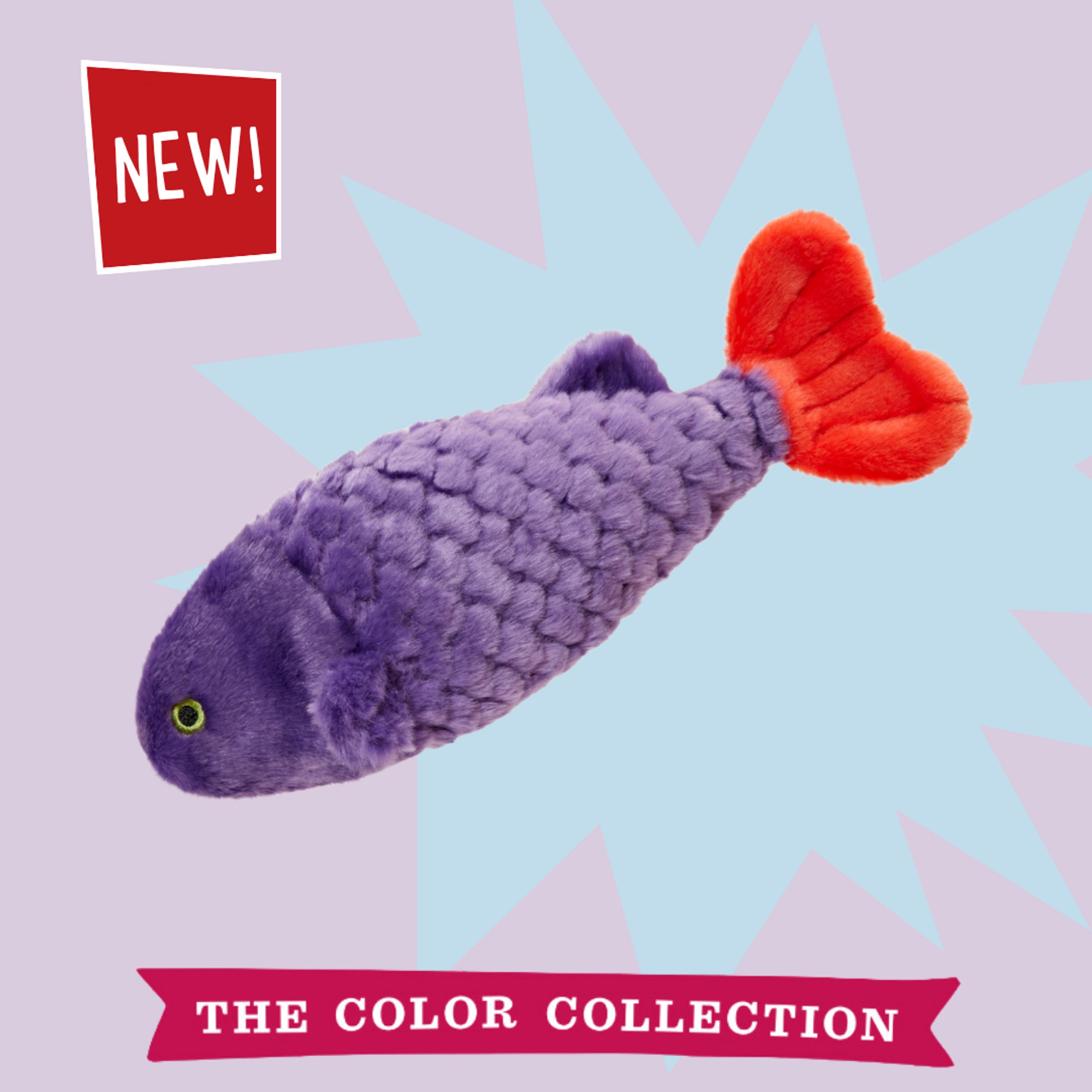 Soft dog toy stuffed fish in deep purple with scale-like texture, a lime-green embroidered eye, and a bold red tail fin.